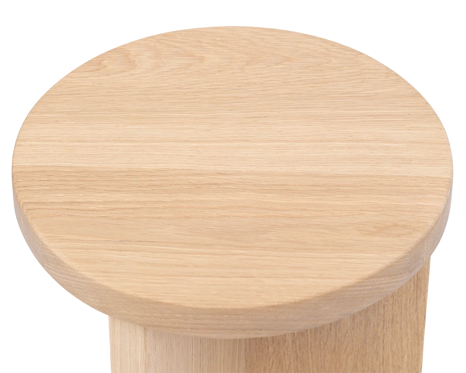 Top view of the Affe Pedestal by Crea, showcasing the smooth, rounded solid oak surface with visible wood grain texture.