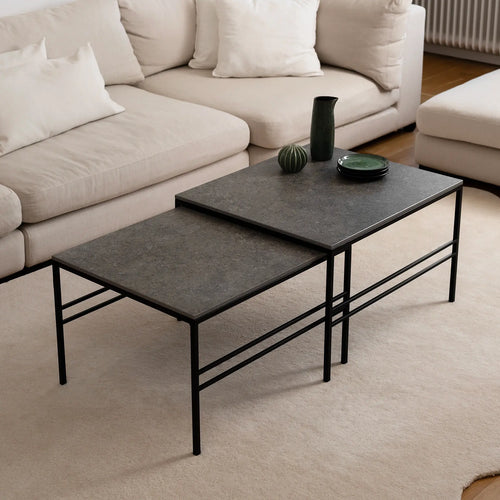 Contemporary Anton Coffee Table set in Grafite Dekton with black frame by by Crea. A minimalist 2-piece nesting table arrangement styled in a Scandinavian living room for functional sophistication.