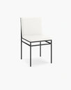 Bella Dining Chair with Ivory leather seat on a sleek black frame for modern dining decor.