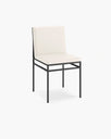 Bella dining chair in sand leather with black frame, showcasing modern elegance and sophistication.
