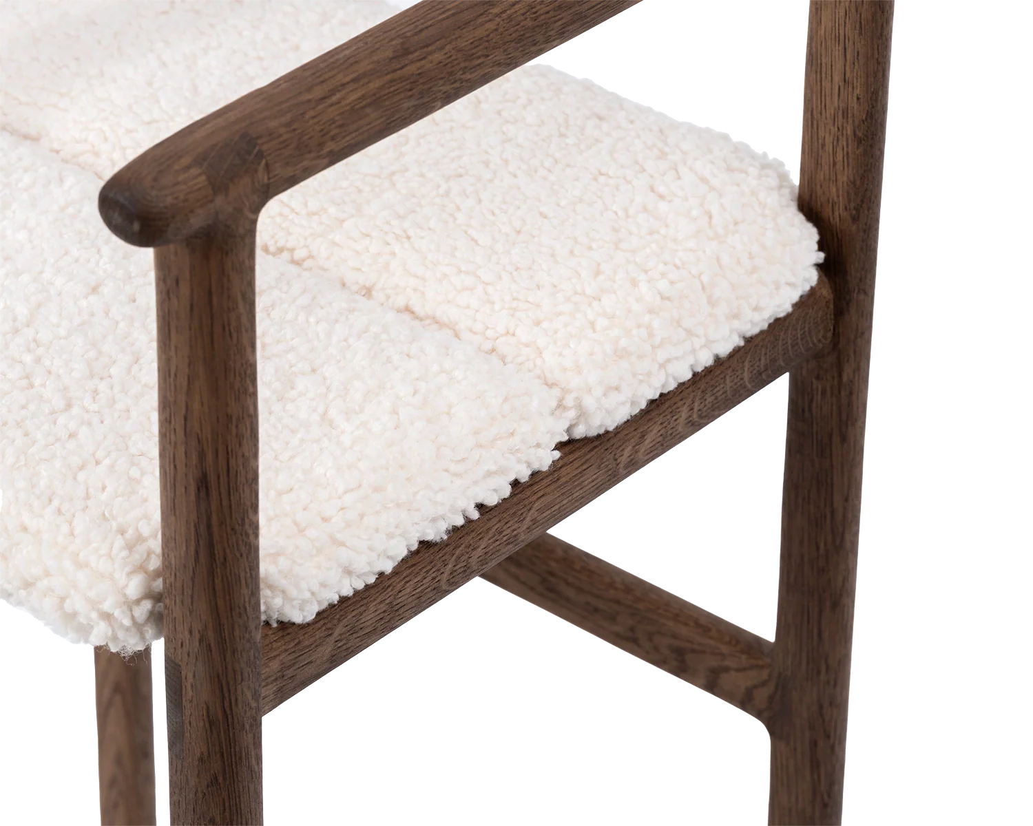 Side view detail of Carl Bar Stool armrest, frame in dark oak with ivory bouclé cushion | by Crea.