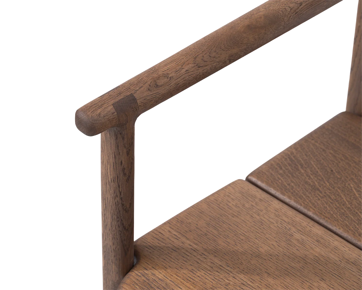 Erik Dining Chair armrest detail in dark oak, highlighting the smooth rounded joinery and craftsmanship | by Crea.