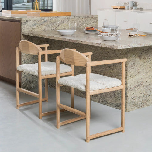 Erik dining chair in oak with ivory bouclé, perfect for warm and stylish dining spaces.