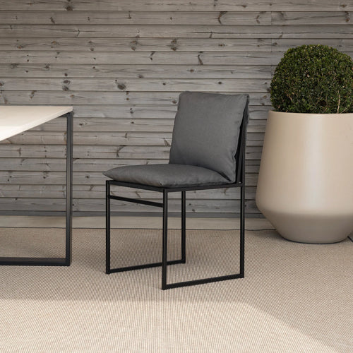 Isa Outdoor chair in black with onyx acrylic cushion, enhancing modern outdoor aesthetics.