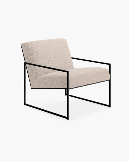 Kent armchair in greige bouclé with black frame, showcasing Scandinavian design and comfort in a stylish setting.