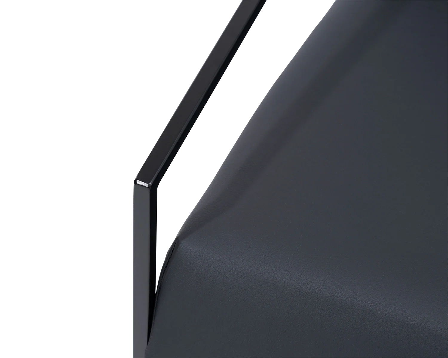 Kent Steel Armchair armrest detail showing black powder-coated steel frame with precision edge and seamless vegan leather upholstery | by Crea.