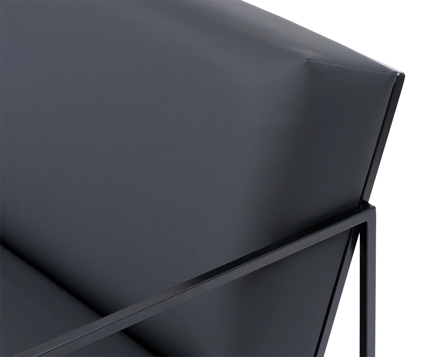 Close-up of Kent Steel Armchair backrest with sharp upholstery lines in black vegan leather, framed by sleek matte black steel | by Crea