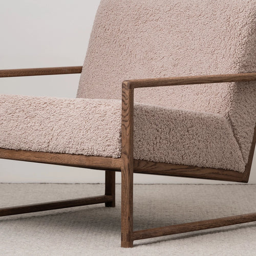 Kent dark oak armchair with greige bouclé upholstery, perfect for neutral interiors with texture and depth.