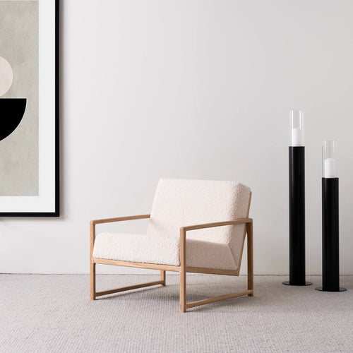 Kent oak armchair with ivory bouclé fabric, featuring a solid wood frame and modern Scandinavian design.