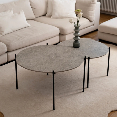 Leo Coffee Table 2-set from by Crea with Grigio Dekton tops and black steel frames, styled in a minimalist Scandinavian living room with a cream sofa and wool rug. Handmade modern furniture for elegant interiors.