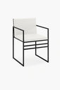 Sella dining chair featuring a black frame and minimalist design with ivory leather seat, perfect for modern interiors.