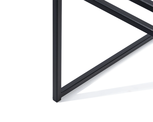 Close-up of the Sella Dining Chair by Crea showing the black powder-coated steel foot with protective plastic glider, highlighting floor-safe minimalist design and Scandinavian craftsmanship.