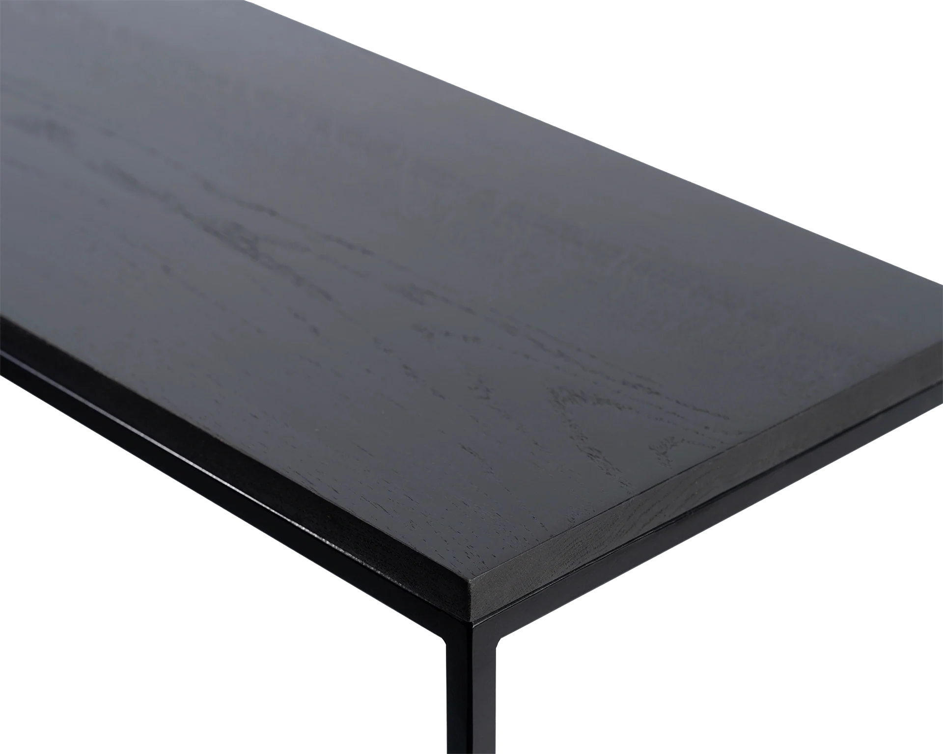 Close-up of corner detail on black oak sideboard top with sleek powder-coated steel frame, highlights natural wood texture and minimalist Scandinavian craftsmanship.