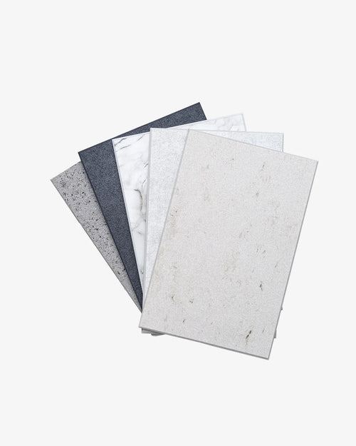 Sample stone surfaces including white, gray, and black choices for home design and renovation.