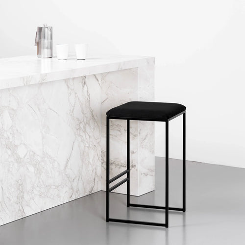 Svea Bar Stool in black velvet with black frame, modern design for kitchen islands and high tables.