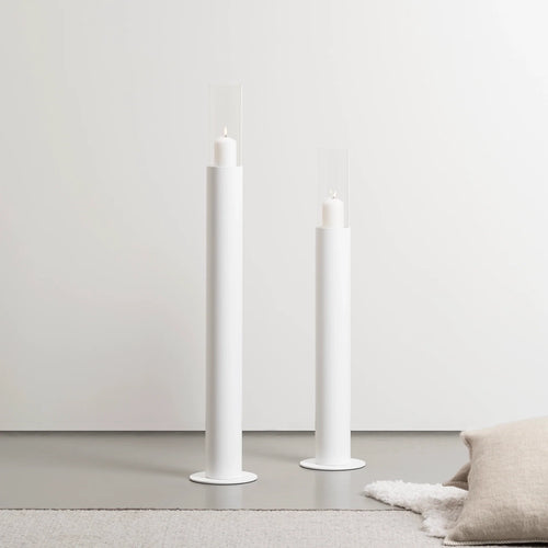 Set of 2 white floor candleholders, minimalist design, perfect for brightening up your space with calm, clean style.
