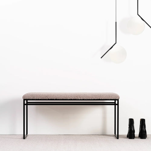 Wilma bench in black with greige bouclé, featuring a sleek design perfect for modern interiors.