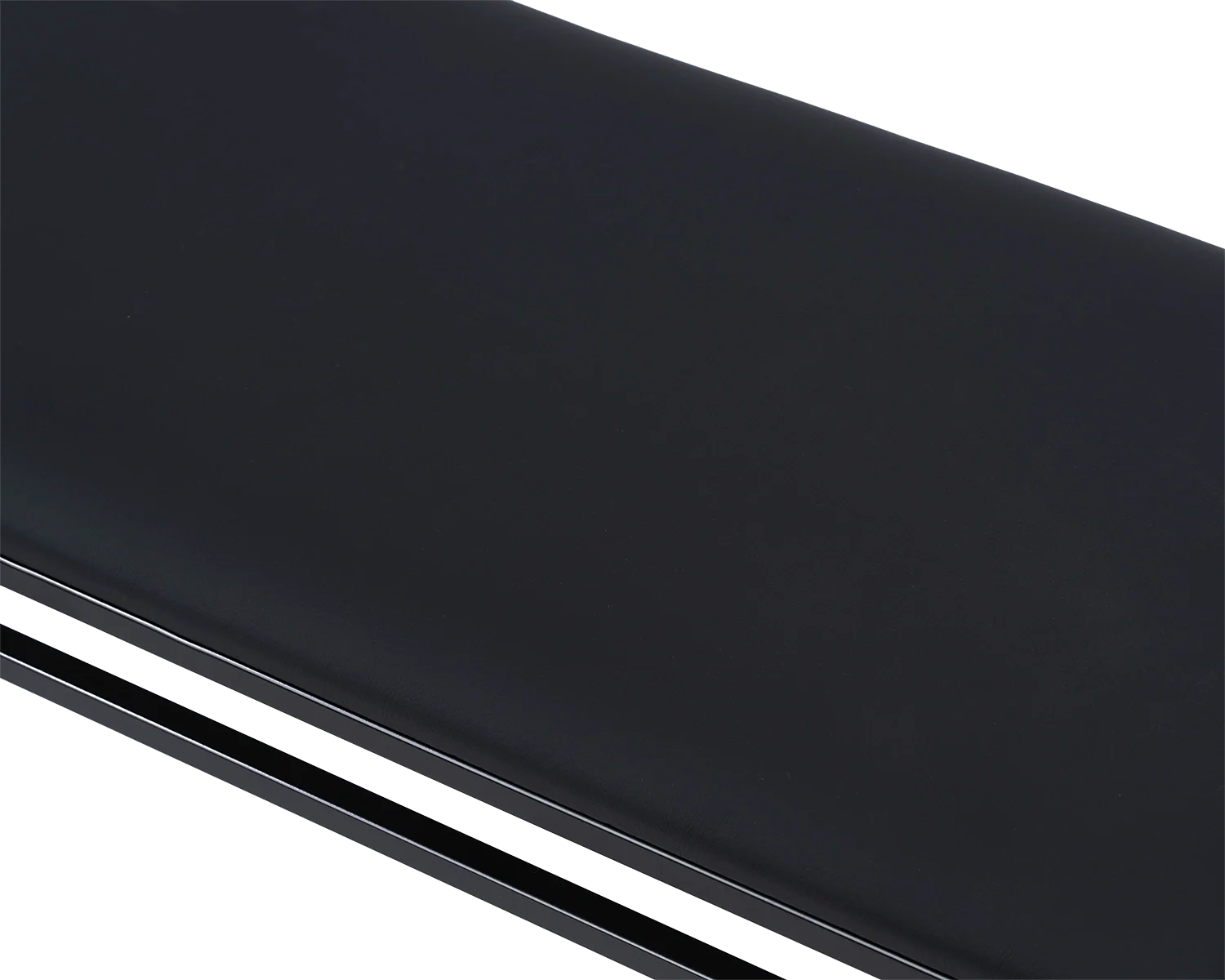 Wilma Steel Bench cushion detail in black vegan leather, showcasing smooth texture and seamless fit | by Crea.