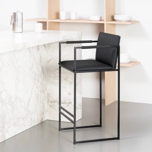Bruno bar stool in jade black leather with black armrests, featuring a matte black frame and clean lines for modern interiors.