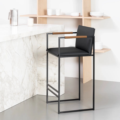 Bruno bar stool in jade black leather with coffee bean armrests, perfect for kitchen islands and bar counters.