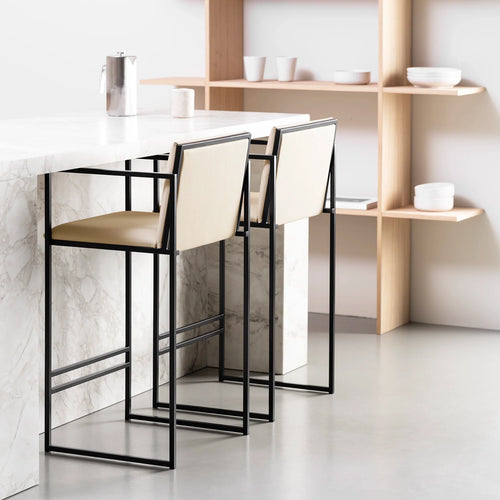 Bruno bar stools in black and sand leather, modern Nordic design for kitchen islands and open-plan dining.