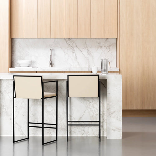 Bruno bar stool in black and sand leather, featuring armrests, perfect for modern kitchen islands and open-plan dining.