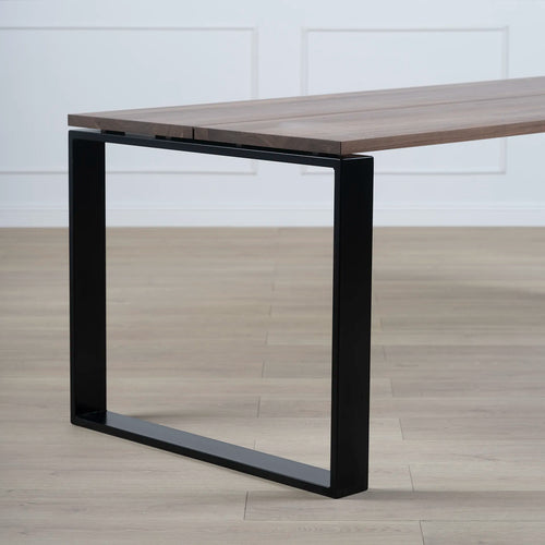 Diana dining table in black with dark oak top, featuring a modern minimalist design and bold geometric base.