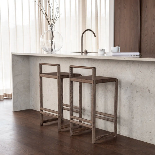Ebba Bar stool in dark oak, featuring a sleek, modern design perfect for contemporary kitchens and dining areas.