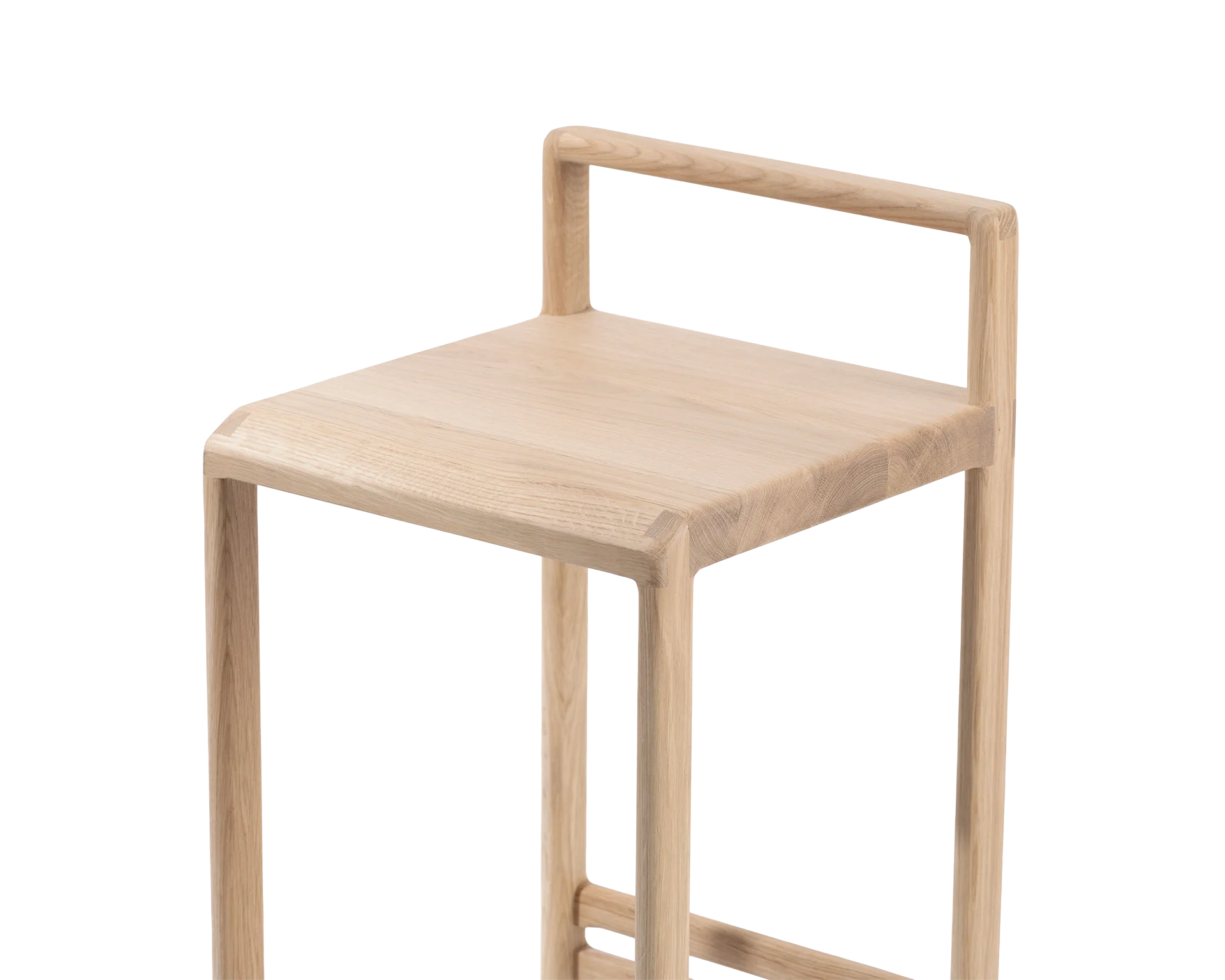 Close-up of the Ebba Bar Stool from by Crea, highlighting the smooth joinery of the solid light oak seat and rounded low backrest, showcasing minimalist Scandinavian craftsmanship.