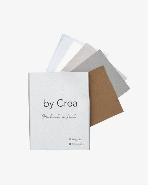 Fabric samples from by Crea for tactile exploration, showcasing various colors and textures, handcrafted in Sweden.