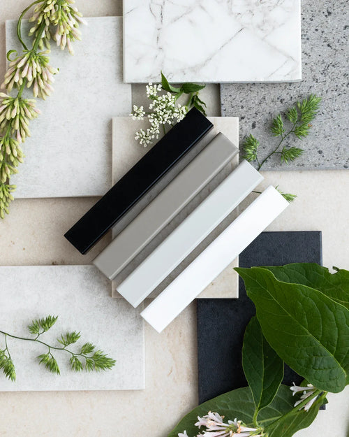 Collection of frame color samples on textured backgrounds to help you choose the perfect finish for your home.