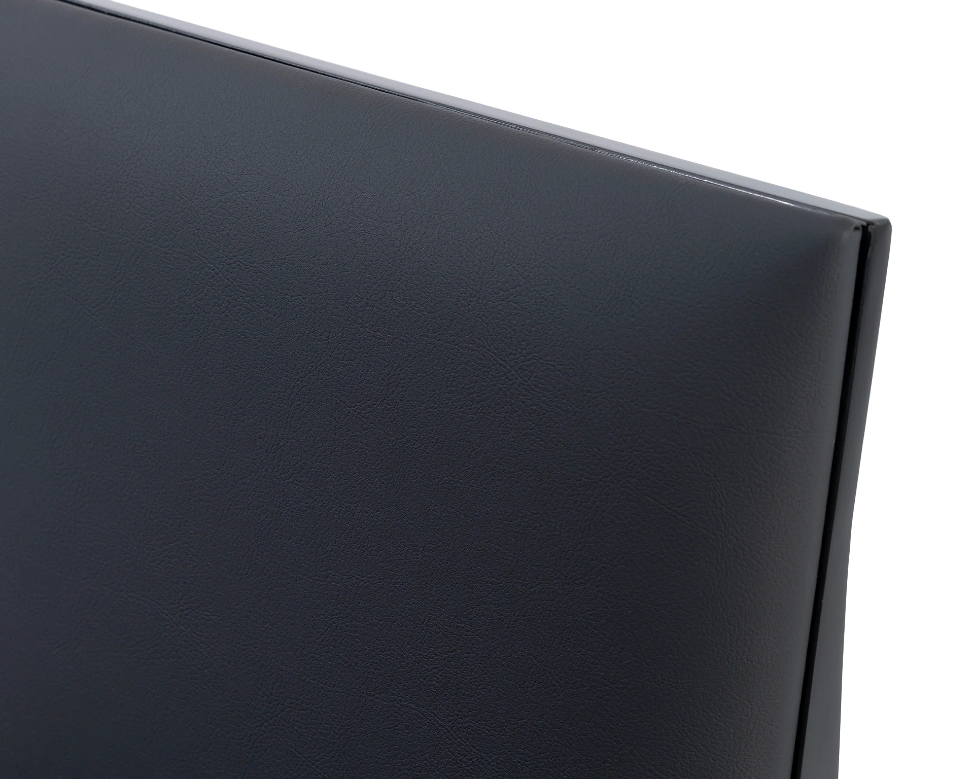 Close-up of the Isabell Dining Chair backrest by Crea, featuring smooth black vegan leather upholstery and a powder-coated steel frame for a refined Scandinavian look.