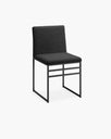 Black bouclé dining chair with matching frame for a stylish and modern look.