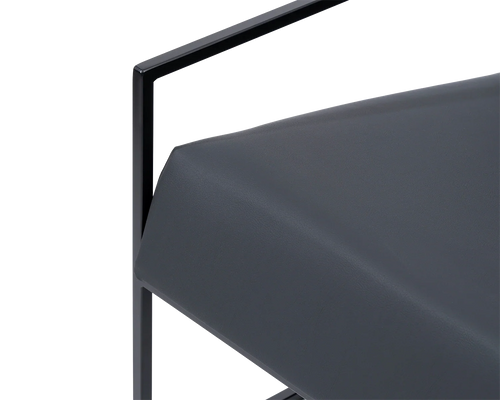 Detail of Kent Steel Armchair seat cushion in black vegan leather with crisp tailoring and minimal steel frame | by Crea.