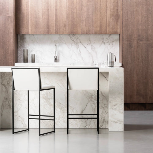 Philip Bar stool in black frame with ivory leather seat, ideal for modern interiors and elegant comfort.