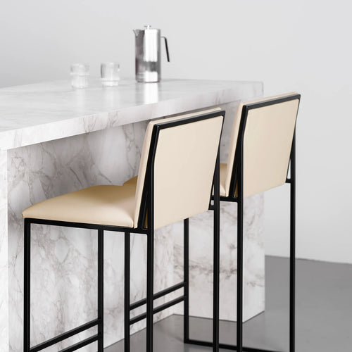 Philip Bar stool in black frame with sand leather seat, perfect for modern kitchens with a minimalistic style.