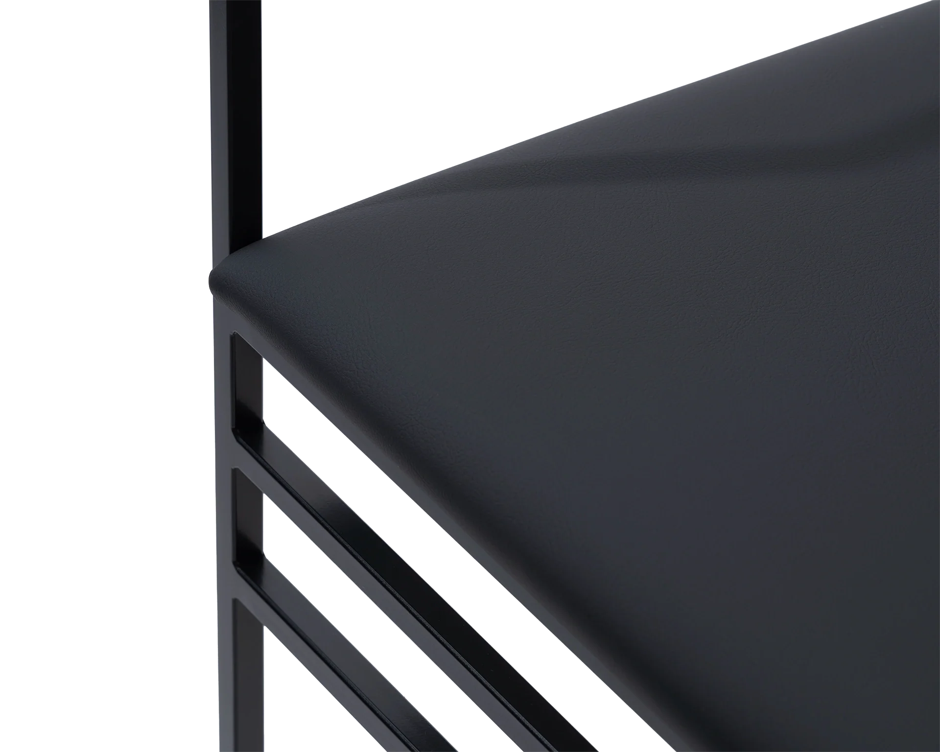 Close-up of the Sella Dining Chair cushion in vegan leather with black powder-coated steel frame, Scandinavian minimalist craftsmanship.
