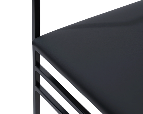 Close-up of the Sella Dining Chair cushion in vegan leather with black powder-coated steel frame, Scandinavian minimalist craftsmanship.