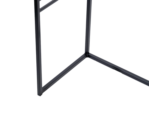 Detail of powder-coated black steel frame at the base of a minimalist sideboard, showcases clean lines and Scandinavian-inspired craftsmanship.