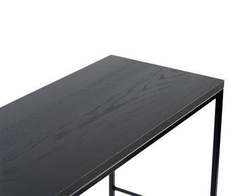 Detail view of black oak top on modern sideboard with matte powder-coated steel frame, high-quality close-up in PNG format highlighting natural wood grain and edge profile.