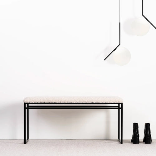 Wilma bench in black with ivory bouclé, featuring sleek Scandinavian design for hallway, bedroom, or entryway.