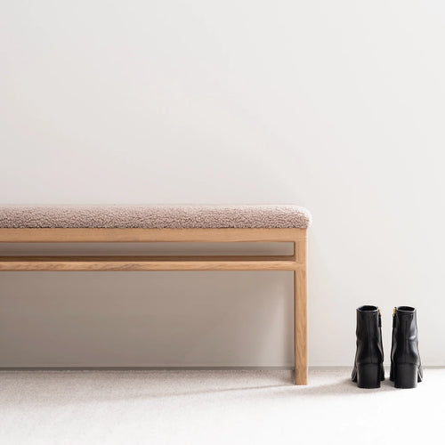 Wilma wood bench in oak with greige bouclé, perfect for entryways, bedrooms, or under windows.